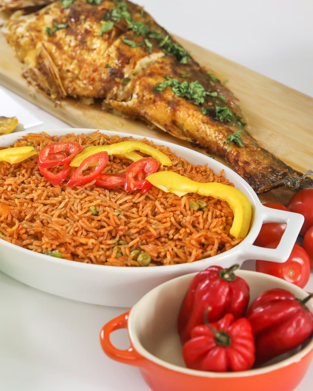 Jollof rice with grilled fish and skewers