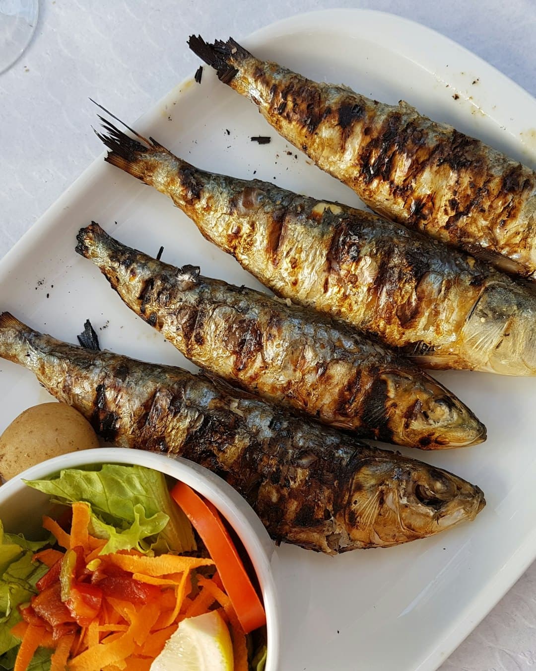 Grilled fish with vegetable salad